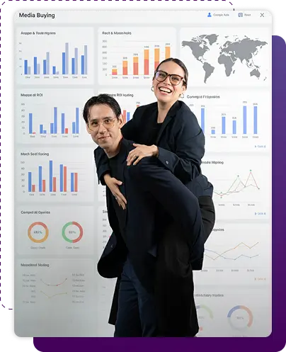 Two marketing professionals smiling and posing playfully in front of a digital dashboard with charts and analytics about media buying performance