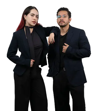 Two professionals in modern business attire posing confidently in a studio portrait.