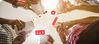 a group of people checking in their smartphones