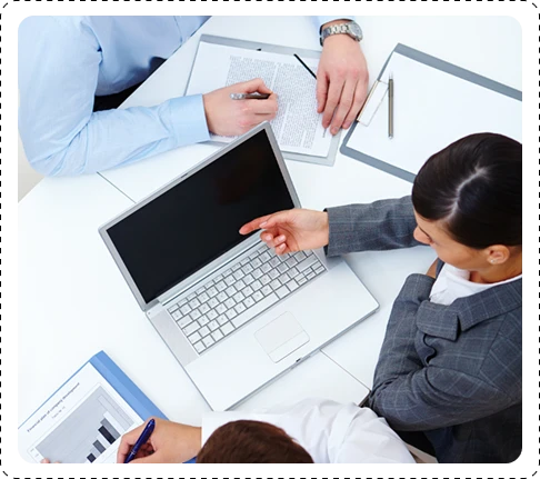 team members reviewing documents for a project
