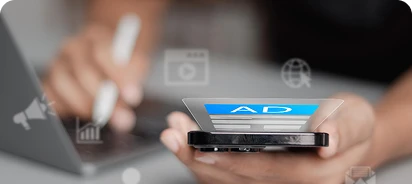 staff member reviewing her phone about an ad campaign