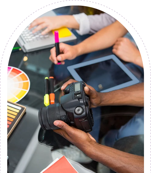 image of a meeting in a digital agency reviewing images in a camera