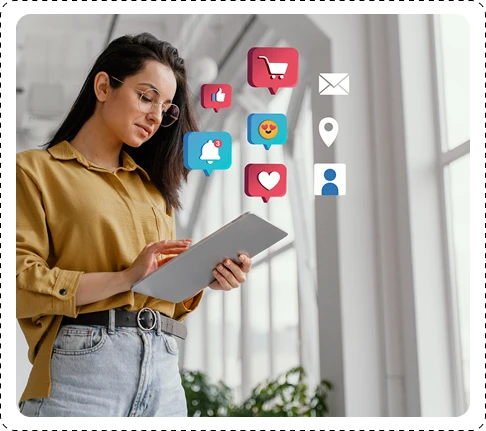 woman checking a laptop and social icons floating around her
