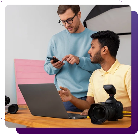 team members reviewing camera equipment