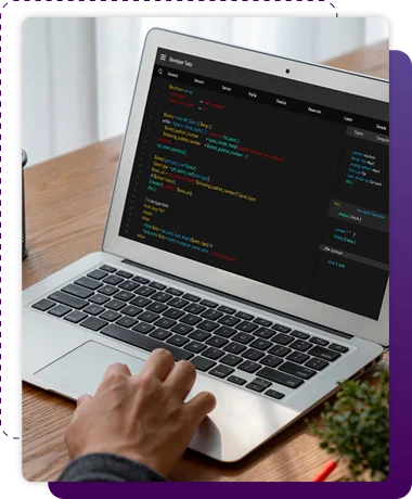 web developer working on laptop editing website a code