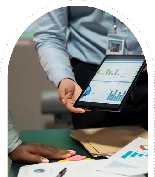 a staff member showing a graph of projections for the business